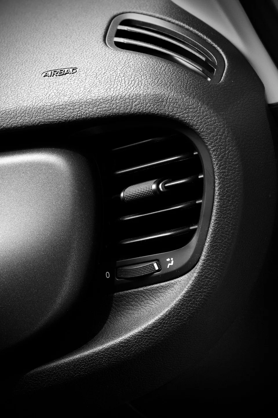 Close view of an automotive air conditioning vent